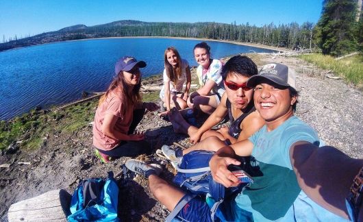 employees by lake during break