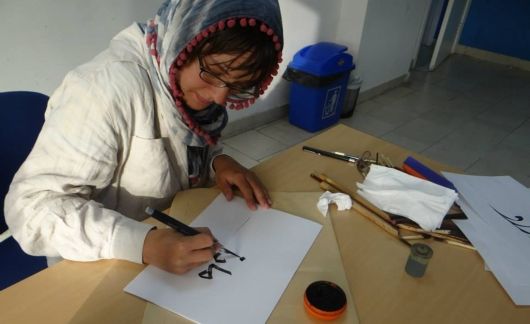 arabic student learning language calligraphy