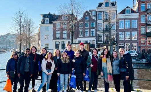 amsterdam students by canal fall semester