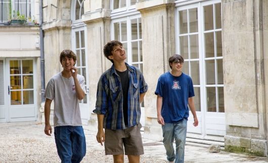 High school boys strolling down the street in Paris