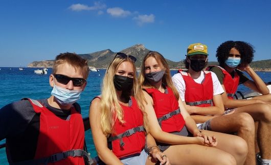 High school students on boat in Palma de Mallorca wearing life jackets