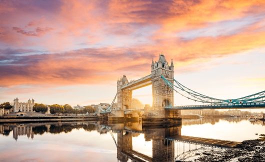 London bridge in an orange and purple sunset