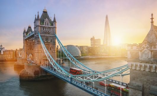 London Tower Bridge with cars at sunset