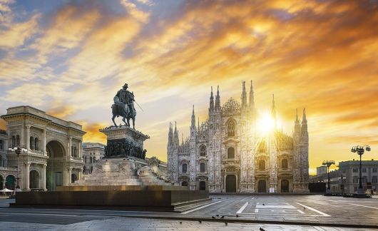 milan city center at sunset statue building