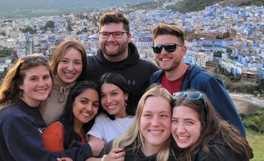 students in rabat smile at city overlook
