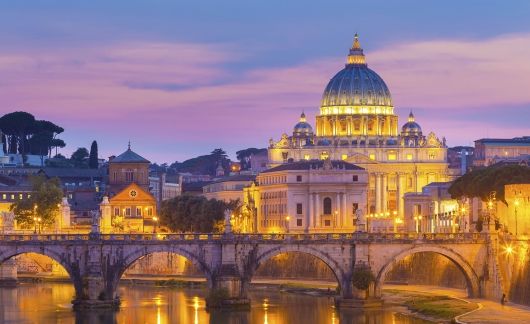 View of Rome, Italy from the water at sunset 