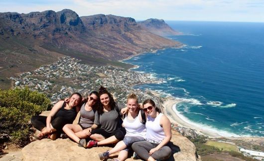 students on cape town cliff