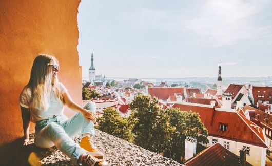 Tallinn girl overlooking city skyline