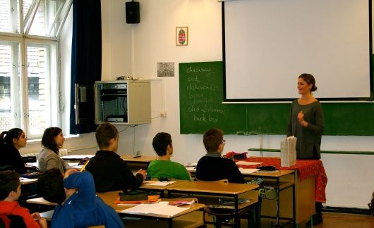 Teacher with students in classroom in Hungary