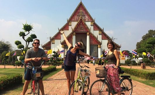 Teachers with bicycles on an outing at a temple in Thailand