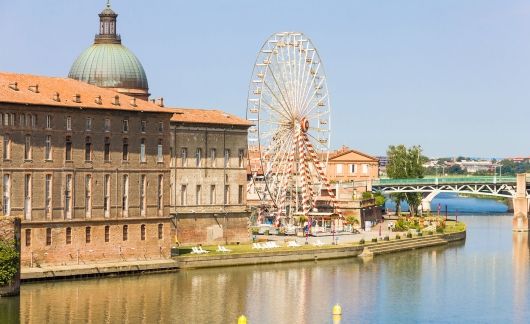toulouse france ferris wheel water building