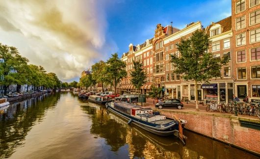 Amsterdam boat in canal in golden light