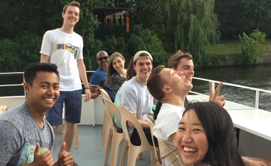 berlin intern group smiling together boat ciee