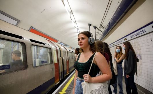 High school student waiting for the Tube in London