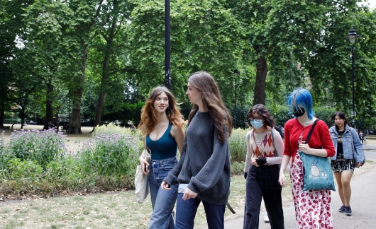 High school students walking in a London park