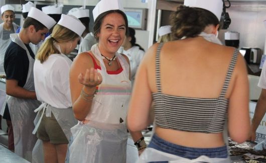 High school students taking cooking class in Barcelona