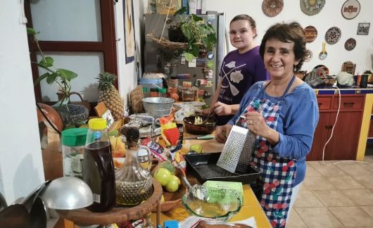 High school student cooking with homestay family in Yucatan