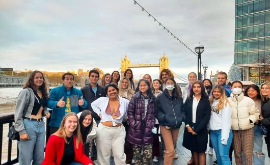 London group of students posing with Tower Bridge