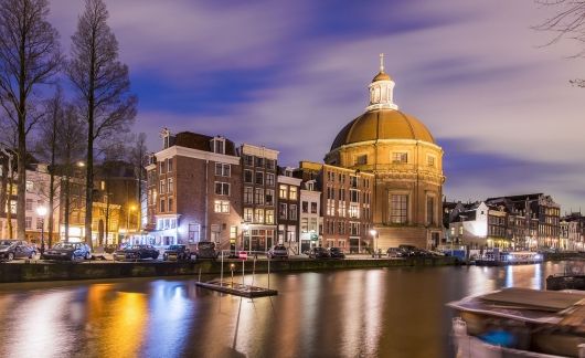dome building amsterdam nighttime canal