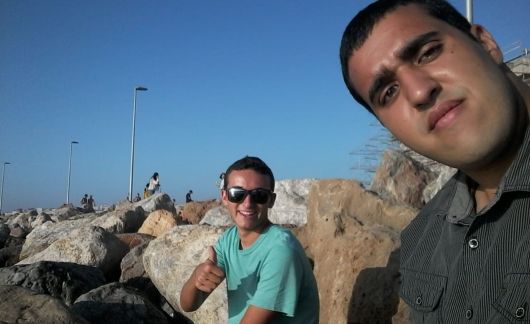 students in rabat sitting on beach