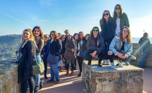 rome large group of students at a castle