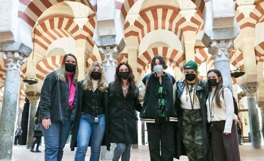 Seville student group under arches