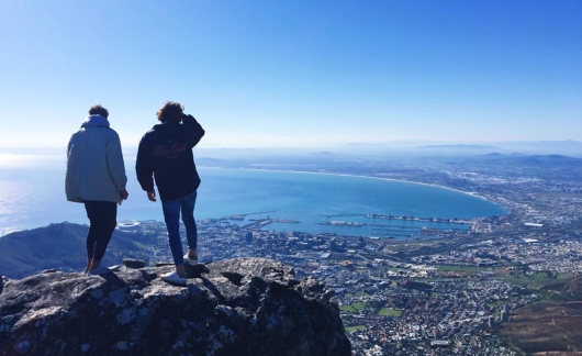 students overlooking city cape town ocean