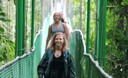 student cross bridge costa rica green