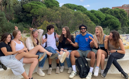students laughing abroad barcelona city overlook