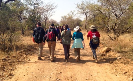 gaborone students on hike walking away from camera