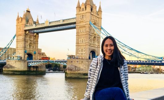 london tower bridge student sitting on wall