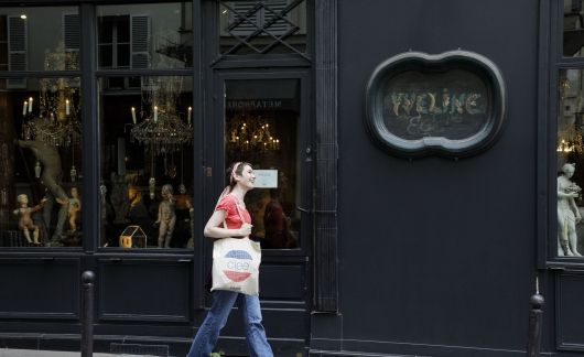 Student walking down elegant street in Paris