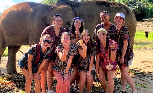 Group selfie at an elephant sanctuary in Thailand