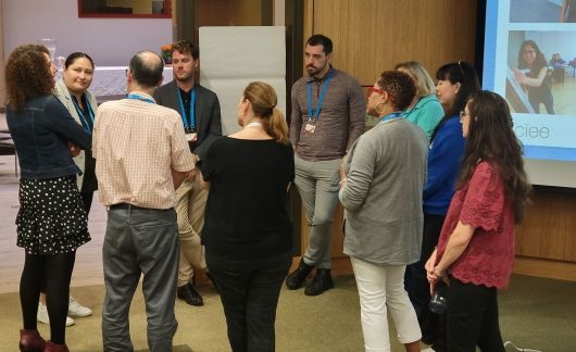 Group huddle at a professional development symposiun