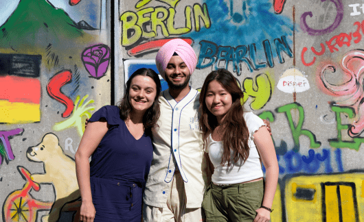 Group shot in front of wall in Berlin