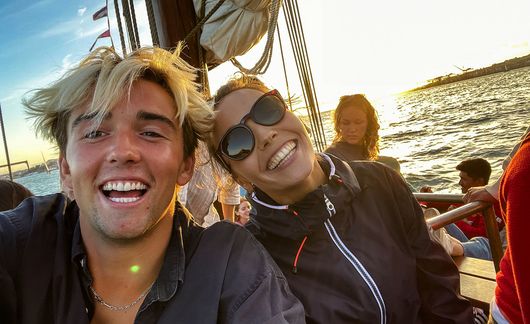 lisbon students taking a selfie on a sail boat