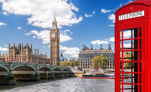 Phone booth by the side of the Thames River in London