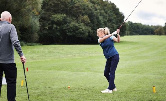 girl golfing in scotland