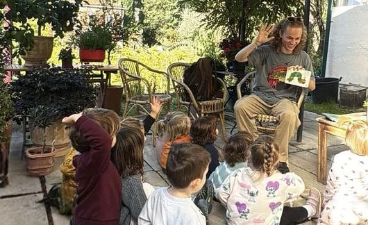 Student reading to kids