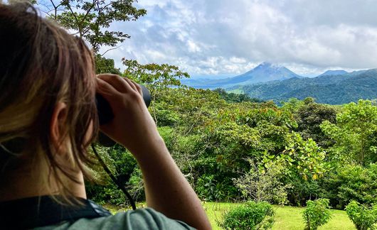 monteverde-girl-binoculars-arenal-volcano