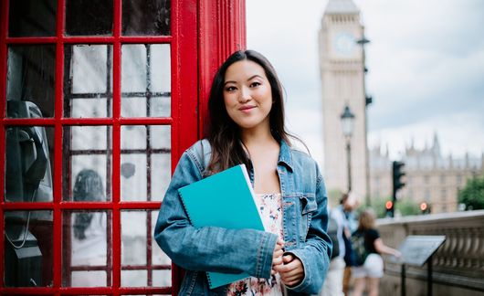 London student standing near phone booth