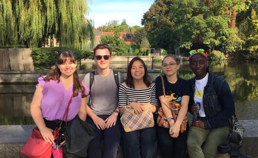 CIEE students sitting by lake in Brussels, Belgium