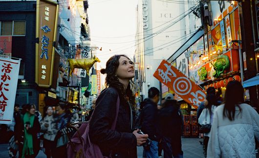 Woman exploring Osaka city during Japan trip
