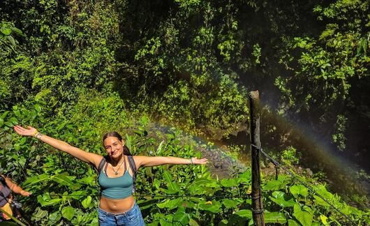monteverde-student-in-front-of-waterfall.JPEG