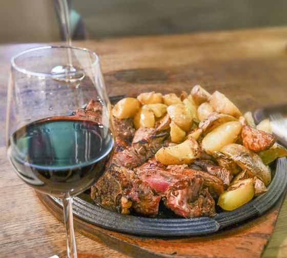 Florence plate of meat and vegetable with wine glass