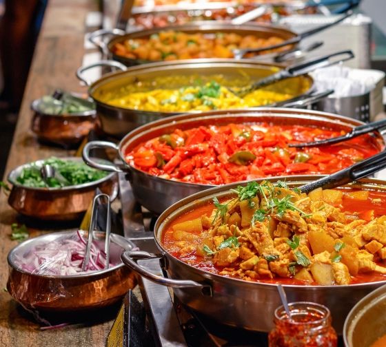 London curry dishes lined up in a buffet service