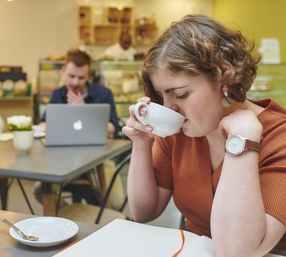 London girl sipping tea