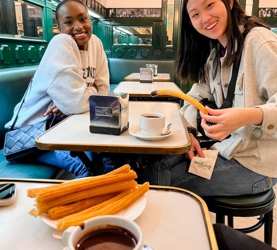 Madrid students eating churros at cafe