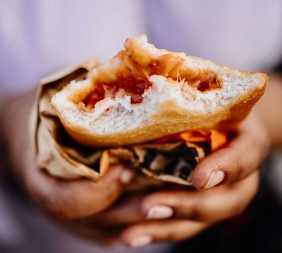 Milan hands holding food