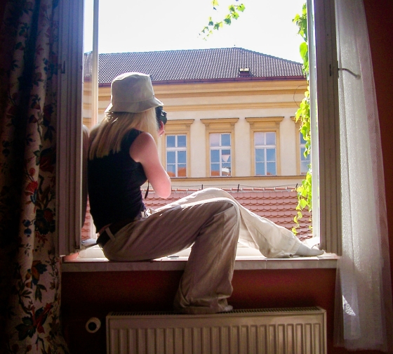 prague girl in window with camera